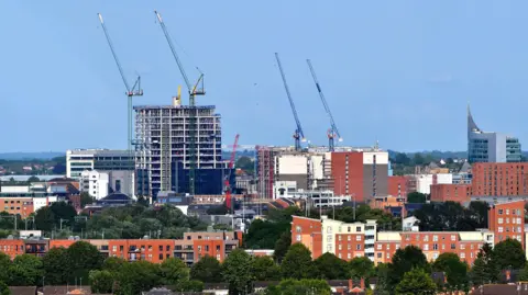 A skyline across Reading, including tall buildings. 