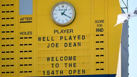 A yellow golf scoreboard.