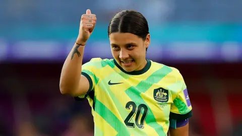 Sam Kerr celebrates scoring against the Philippines 