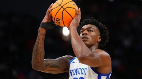 Amari Williams #22 of the Kentucky Wildcats wear a white vest with blue lettering