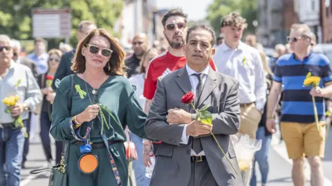 Danny Lawson/PA Wire Emma Webber and Dr Sanjoy Kumar