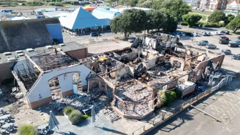 A destroyed building which has been burned by fire.