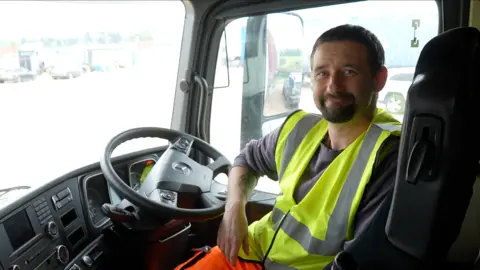 Paul Brown behind the wheel of a lorry