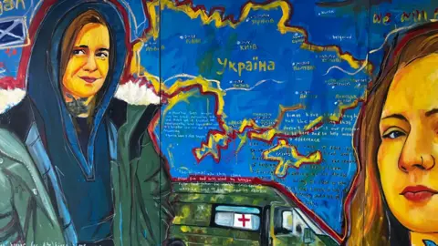 A painting showing different angles of the same girl against a map of Ukraine and an aid truck. She has a tattoo on her neck and is wearing a blue hoodie and a green jacket with a fluffy collar.
