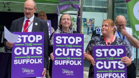 People rally outside Suffolk County Council building in Ipswich.