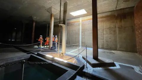 Shaun Whitmore/BBC Engineers in the underground reservoir