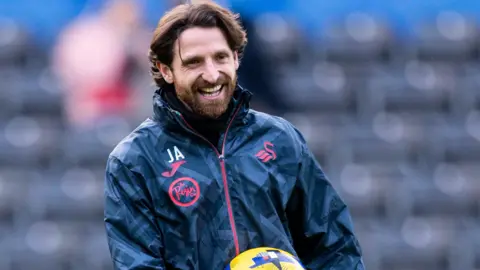 Joe Allen before a Swansea game this season 