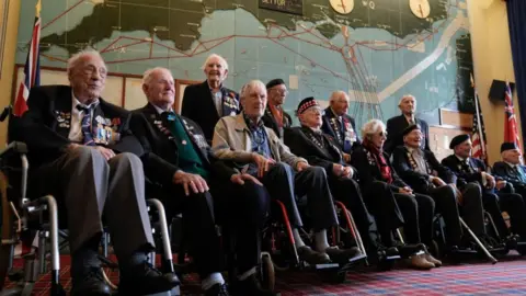 PA Normandy veterans pose for a photograph in the Map room at Southwick House, during an event hosted by the Spirit of Normandy Trust and D-Day Revisited at Southwick House, the nerve centre of D-Day operations 80 years ago, near Portsmouth, Hampshire