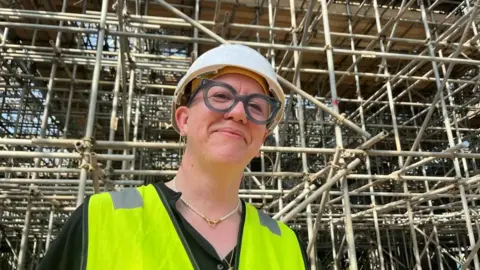 Andrew Turner/BBC Architect Faye Davies pictured next to scaffolding inside the Winter Gardens