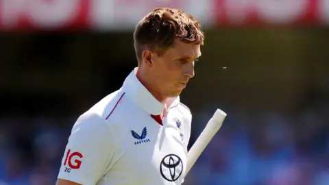 England opener Zak Crawley walks off after being dismissed