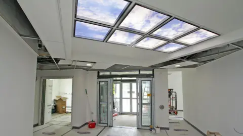 Derbyshire Community Health Services NHS Foundation Trust Inside the new health hub with windows on the ceiling and two doors leading outside