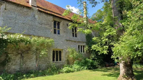 The Friends of Abingdon Abbey Buildings Trust One of the Abingdon Abbey buildings on a sunny day.