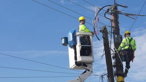 men working on transmission lines