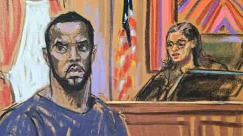 Sean "Diddy" Combs stands before U.S. Magistrate Judge Robyn Tarnofsky after prosecutors brought three criminal charges against him in federal court in the Manhattan borough of New York City, U.S., September 17, 2024 in this courtroom sketch