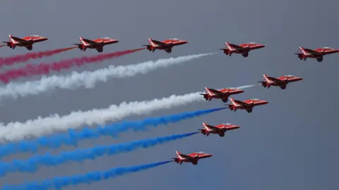 The red arrows with their red white and blue exhaust fumes leaving a trail
