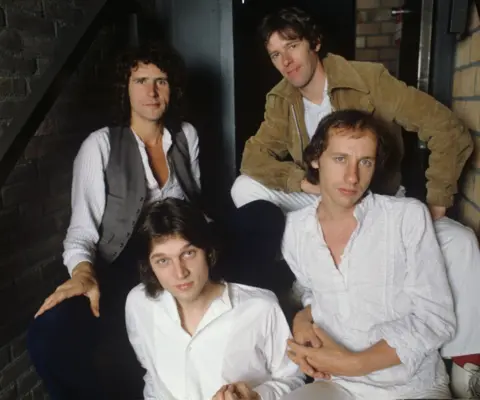 Getty Images A group portrait of Dire Straits, (clockwise from top left) John Illsley, Pick Withers, Mark Knopfler and David Knopfler, in Amsterdam, Netherlands, 1978