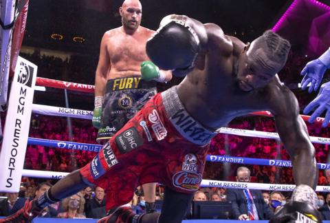 Deontay Wilder hits the canvas after a punch from Tyson Fury