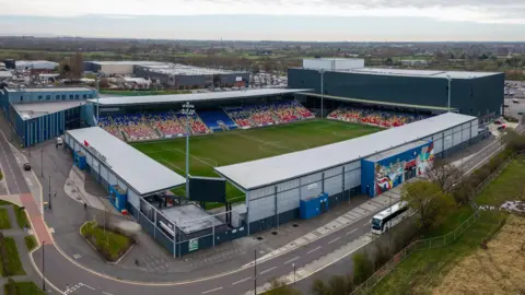 Getty Images Aerial view of the LNER Community Stadium in York which is the home ground of York City FC - corrugated metal stands surrounding a grass football pitch can be seen. A road loops around the outside of the stadium, and fields can be seen in the distance.