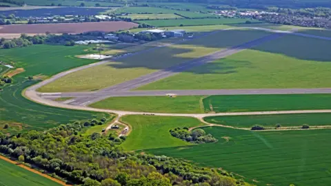 Getty Images/Allan Baxter Another bird's eye view of Chalgrove Airfield, including two runways, surrounded by countryside and, in the top right corner, the village of Chalgrove