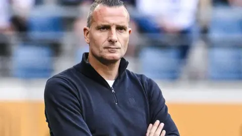 Nicky Hayen watches on from the sidelines during his time as manager of Genk