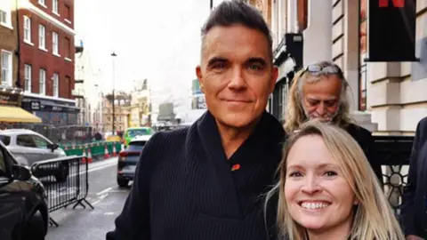 Lucy Champion Lucy Champion with Robbie Williams