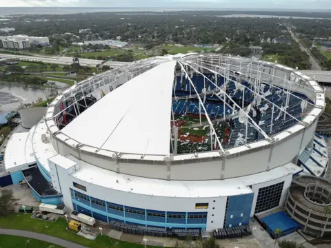 Bryan R. Smith / AFP A drone image shows the Tropicana Field dome ripped open by Hurricane Milton in St. Petersburg, Florida, on October 10, 2024.