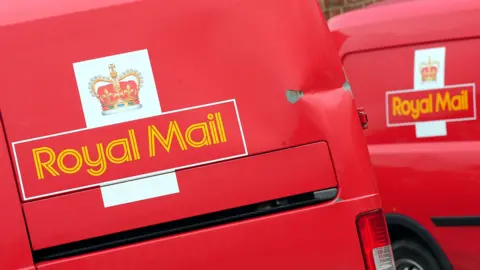 PA Media A general view of red Royal Mail vans.