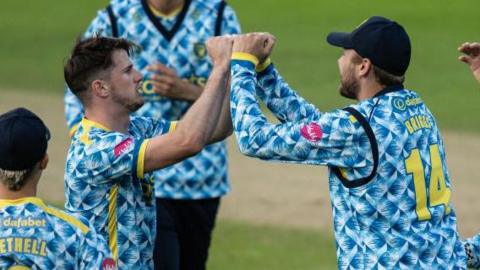 George Garton of Birmingham Bears (2nd left) celebrates with his team mates after taking the wicket of Saif Zaib of Northamptonshire Steelbacks, his second wicket in successive deliveries during the T20 Vitality Blast match between Birmingham Bears and Northamptonshire Steelbacks at Edgbaston on June 20, 2024 in Birmingham, England