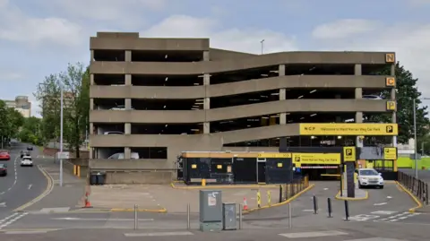 A concrete multi-storey car park. 