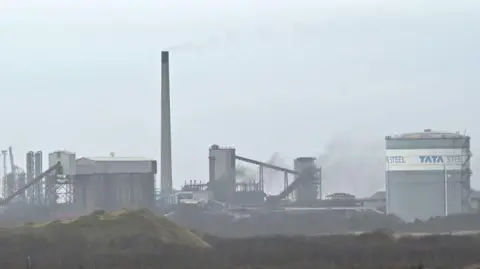 Getty Images The Port Talbot steel plant seen on a hazy day, with the name Tata Steel seen on a building on the right