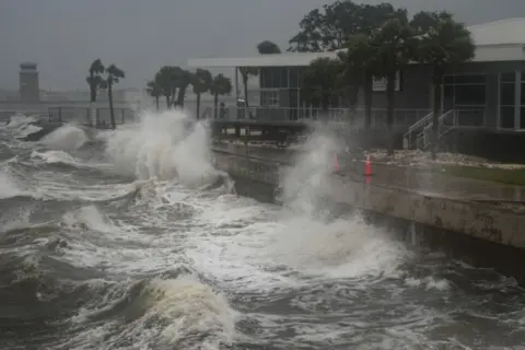 AFP Waves crashing against a shoreline