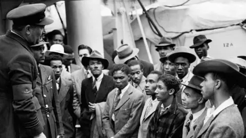 PA Passengers who arrived to Britain on HMT Empire Windrush, in 1948