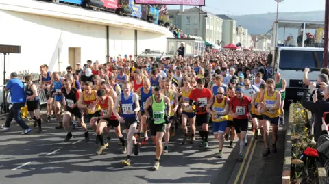 Photofit.com Hundreds of runners set off from Seaton seafront in Devon as they take on The Grizzly race.