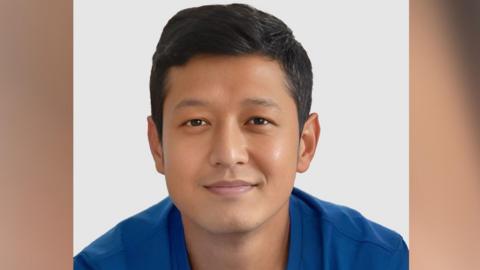 Arjun Gurung smiling for the camera 