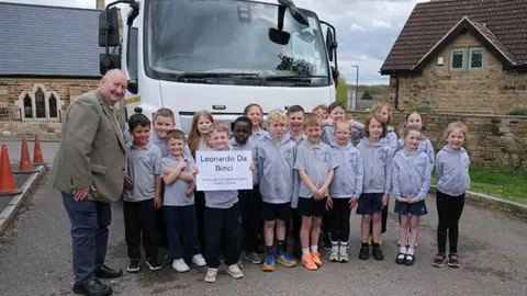 Cllr Pickering (left) with children from Immaculate Conception Catholic Primary School