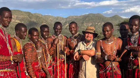 Jason Ingamells/Woodland Ways Maasai dancers with trip organiser, Jason Ingamells