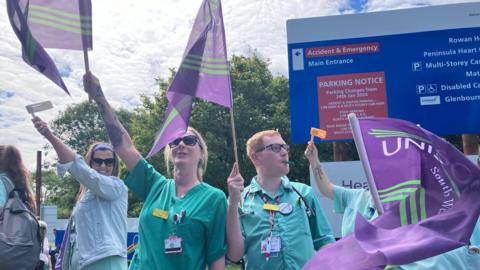Healthcare workers taking strike action outside Derriford Hospital 
