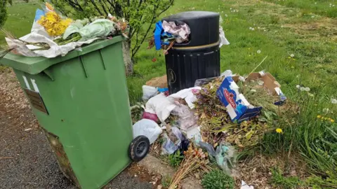 Samatha Curtis Rubbish piled up