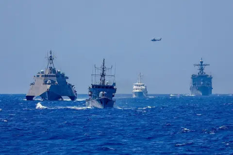 Getty Images A fleet of United States and Philippine warships during drills this weekend