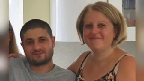 (L-R) Giuseppe Morreale, 29, and Maria Nugara, 54 (maiden name). 
The young man with a beard and the woman has short blond hair. They are both smiling at the camera.