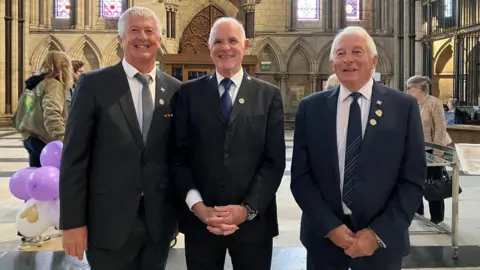 BBC/Oliver Day The three firefighters pictured in the Minster starting from left to right: Steve Alderton, John MacKenzie and Tony Ambler