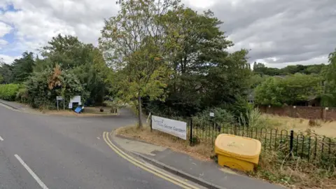 A tree lined piece of land earmarked for flats for elderly and vulnerable people