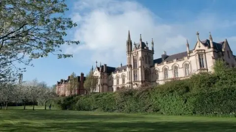 UU The Martha Magee building at Magee campus in Londonderry.
A number of trees and bushes can be seen in front of the historic building.