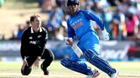 AFP MS Dhoni of India runs between the wickets during game two of the One Day International Series between New Zealand and India at Bay Oval on January 26, 2019 in Mount Maunganui, New Zealand. 