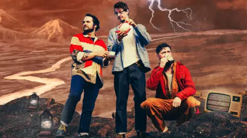 Found Festival The trio, who look fashionably dressed for a pleasant walk, stand in a stylised setting, with a barren land behind them, and a mountain in the distance. A fork of lightning strikes above them. On the soil and rock-covered ground are two lamps, and a retro-looking television showing static on the screen. 