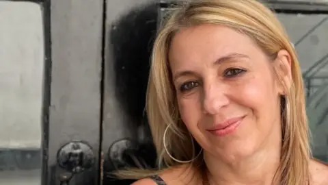 Jamies Niblock/BBC A close-up head and shoulders image of Leyla Edwards. She is smiling and looking directly into the camera.