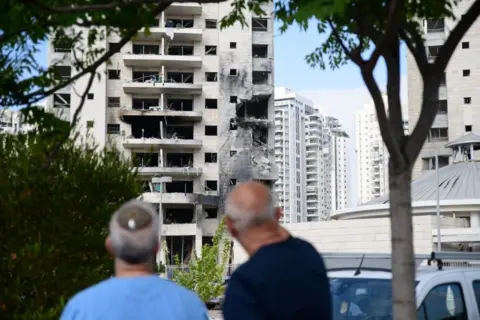 Getty Images A building which was directly hit in Petah Tikva following an Iranian ballistic missile barrage