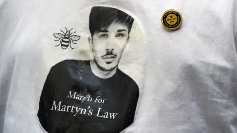 A leaflet advertising a march for Martyn's Law, featuring his image
