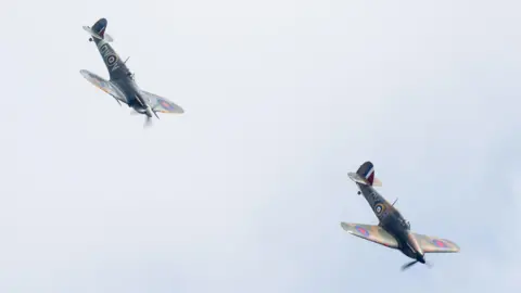 Paul Johnson - Flightline Two Spitfire aircraft flying nose down in formation