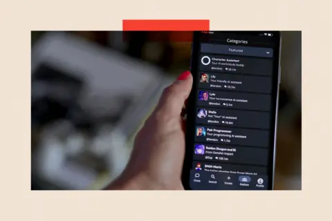 Bloomberg/ Getty Images A hand holding the character.ai app on a smartphone

